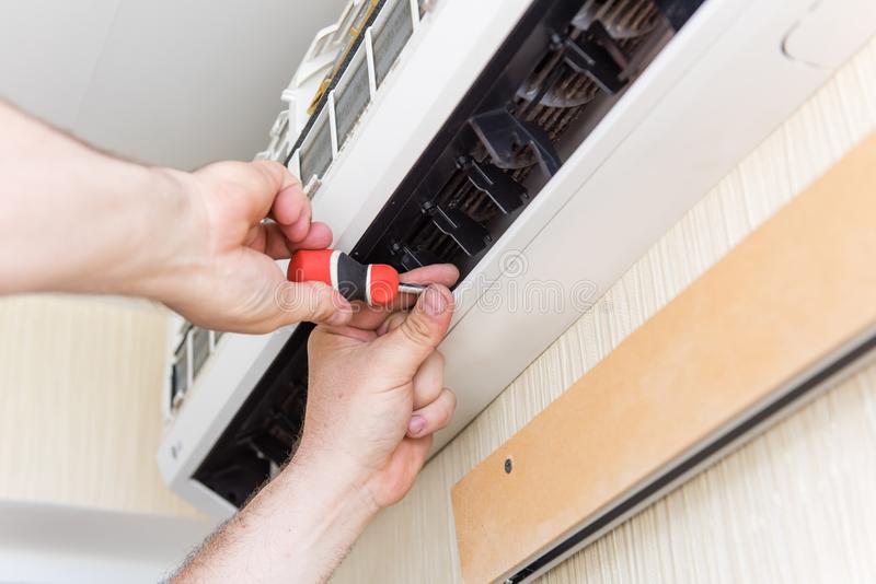 air-conditioning-fix-screwdriver-maintenance-conditioner-master-indoors-male-hands-instruments-116795727 air-conditioning-fix-screwdriver-maintenance-conditioner-master-indoors-male-hands-instruments-116795727